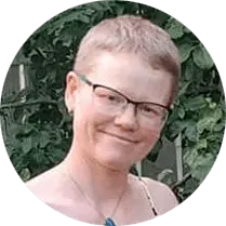 Middle aged practitioner from Alberta Canada with short hair and glasses